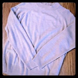 Crewneck sweater with backside zipper.